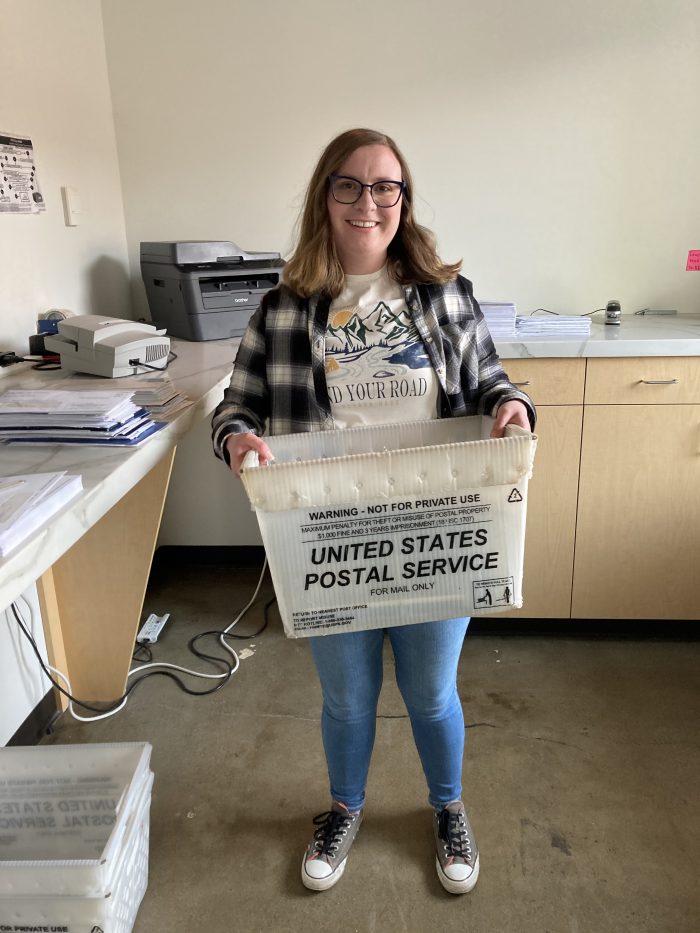 Spokane Team Member Carrying Business Mail for Virtual Office Services